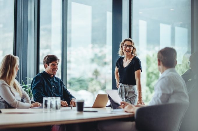 Office,Colleagues,Having,Casual,Discussion,During,Meeting,In,Conference,Room. No one does this alone